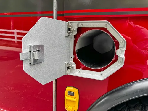 Open side compartment with shelf and door swung outward.